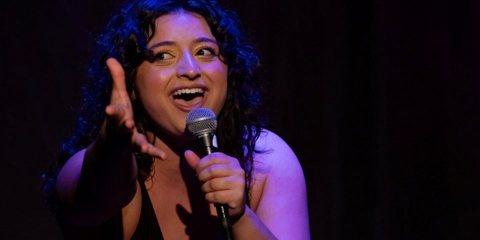 woman singing with microphone